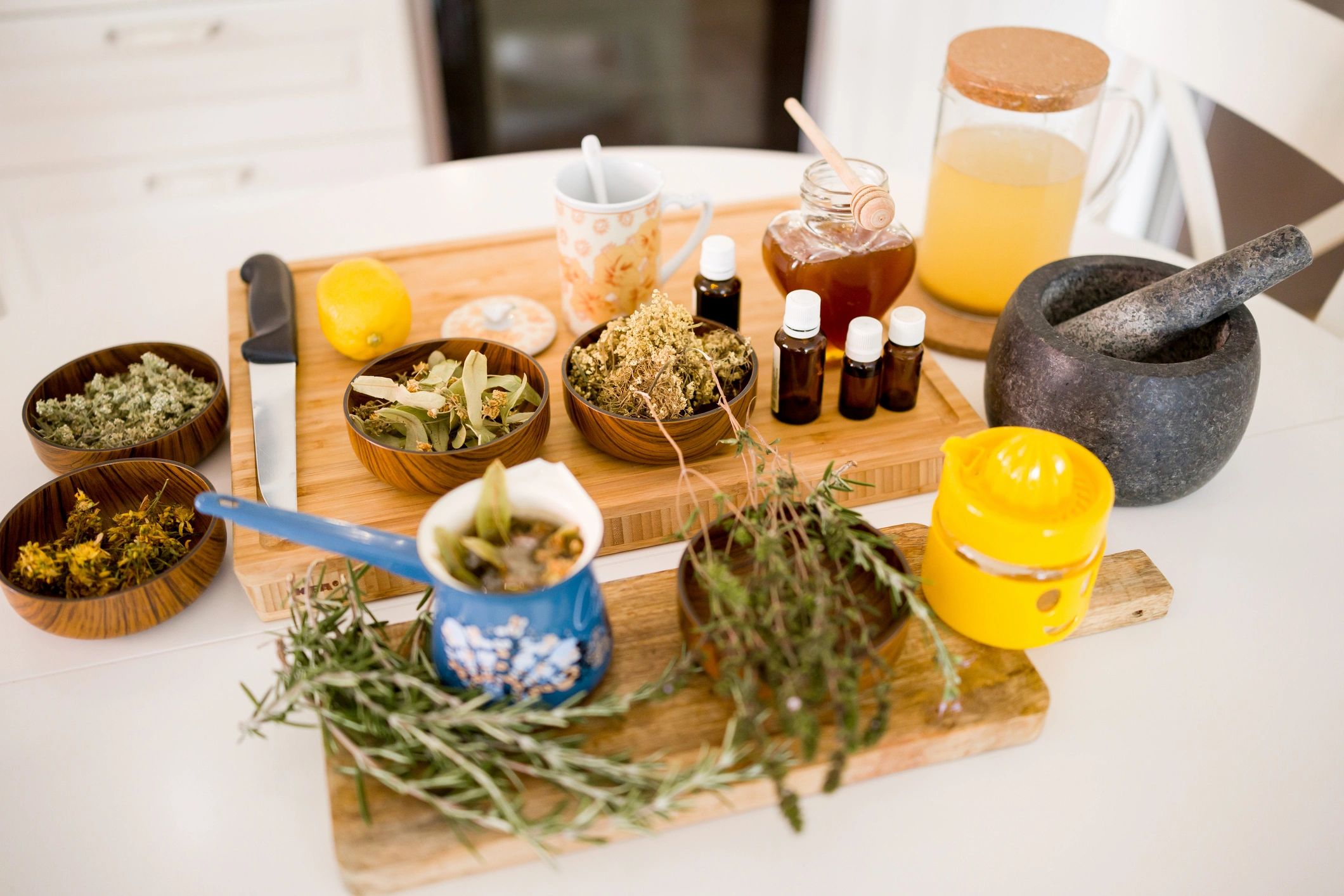 Flat lay of dried herbs and natural remedies in bowls